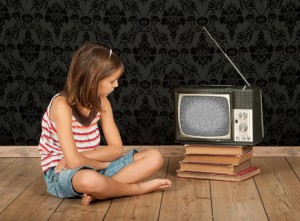 girl watching old tv