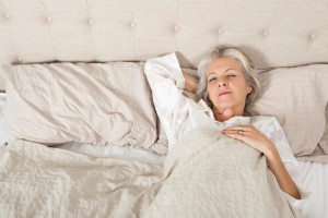 Senior woman sleeping in bed