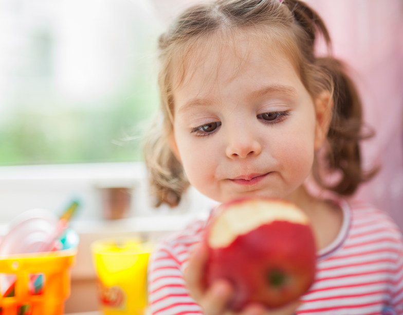 little cute girl eating apple