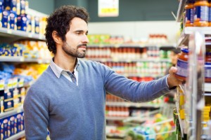 Attractive man shopping in a supermarket sanzioni