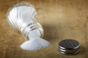 Salt sprinkled on a wooden table