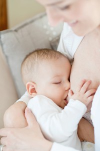 Mother breastfeeding cute baby