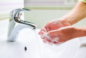 Washing Hands with Soap. Woman Cleaning Hands in a Bathroom